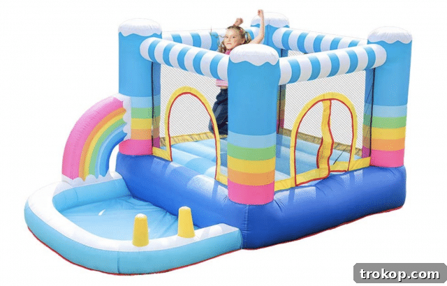 48 Irresistible Toys That Kids Will Love 10 Rainbow-themed inflatable bounce house with slide, great for indoor and outdoor play.