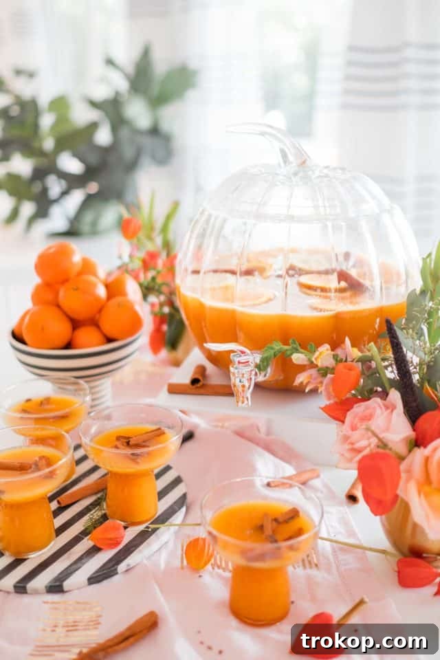 photo of a pumpkin punch bowl and thanksgiving cocktail