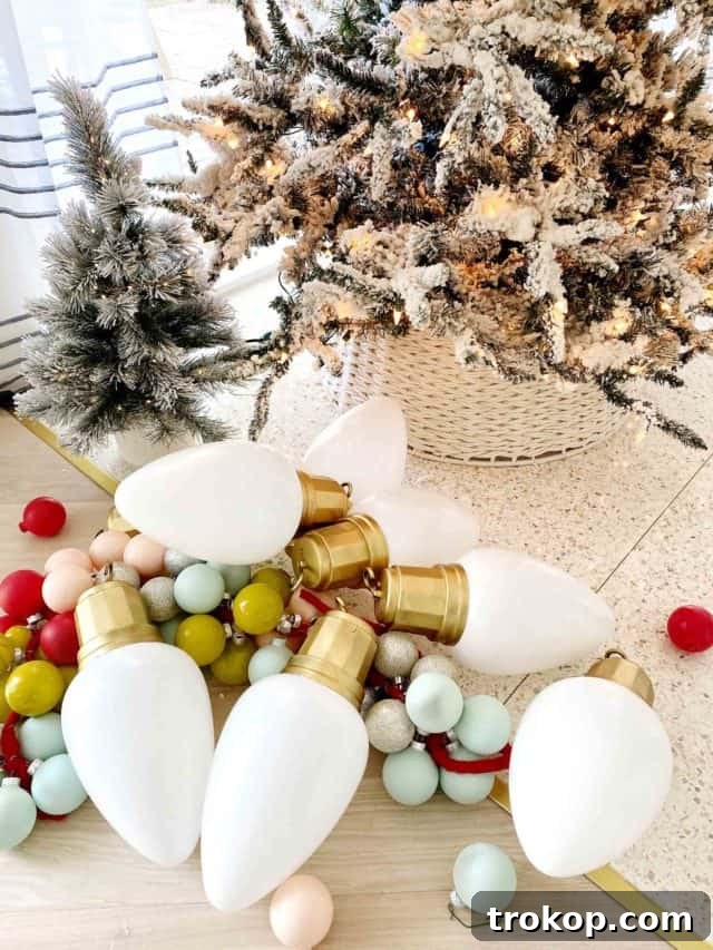 A collection of oversized, gleaming white Christmas bulbs serves as sophisticated and modern holiday decor, adding a touch of grandeur to any festive display.