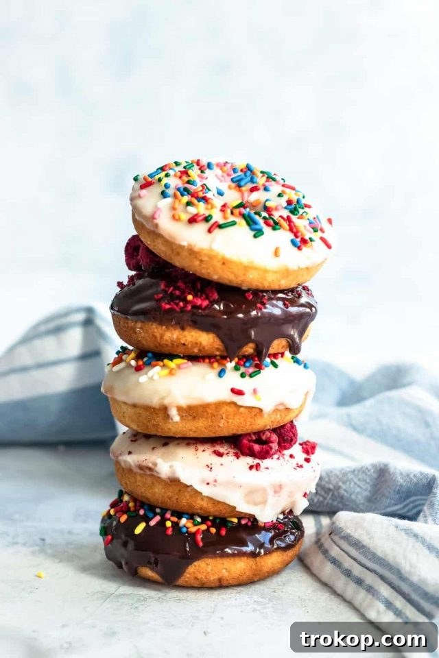 A stack of delicious baked gluten-free donuts, perfectly golden and ready for glazing, by top Houston lifestyle blogger Ashley Rose of Sugar & Cloth.