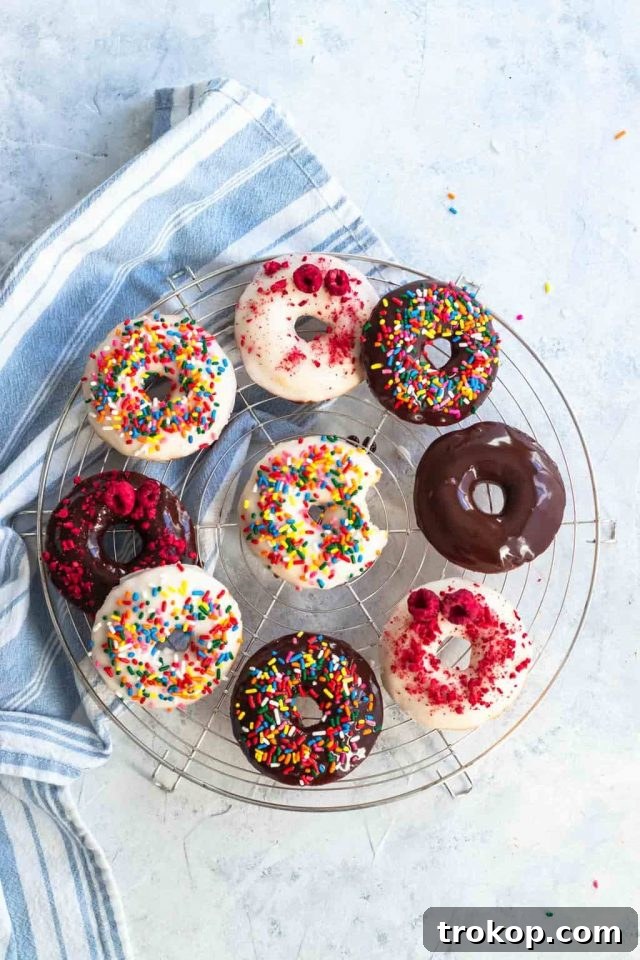 An array of flavored gluten-free donuts, showcasing different glazes and sprinkles, by top Houston lifestyle blogger Ashley Rose of Sugar & Cloth.