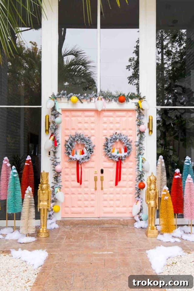 Vibrant Holiday Welcome: Christmas Doorway Designs 14 Pink door with front door Christmas decor and giant bristle brush trees