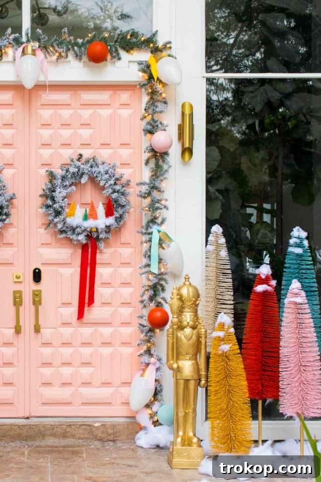 Vibrant Holiday Welcome: Christmas Doorway Designs 7 Front entrance decorated for Christmas with a pink door