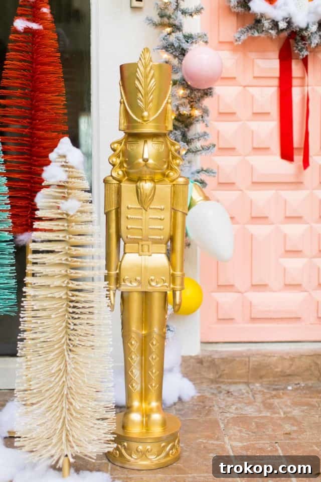 Vibrant Holiday Welcome: Christmas Doorway Designs 9 Jumbo gold nutcracker at front door
