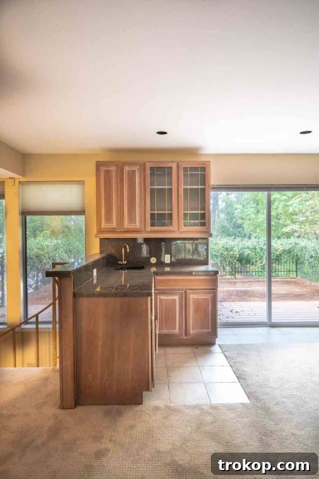 Before photo of our old wet bar area showing dated finishes and an empty space