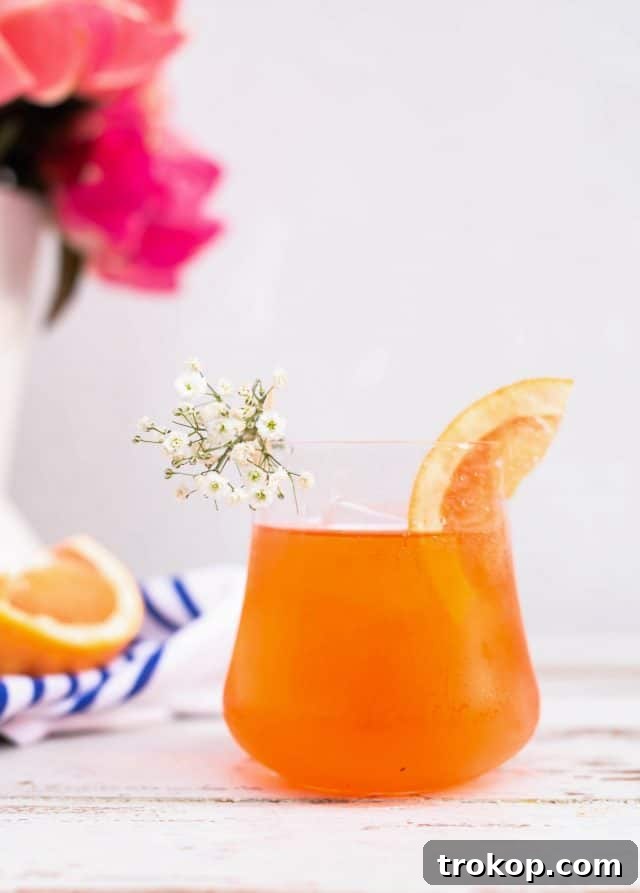 Grapefruit slice and baby's breath garnishes for an Elderflower Aperol Spritz