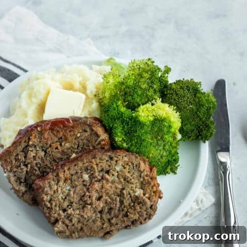 photo of the best easy meatloaf with a side of mash potatoes and broccoli by top Houston lifestyle blogger Ashley Rose of Sugar & Cloth