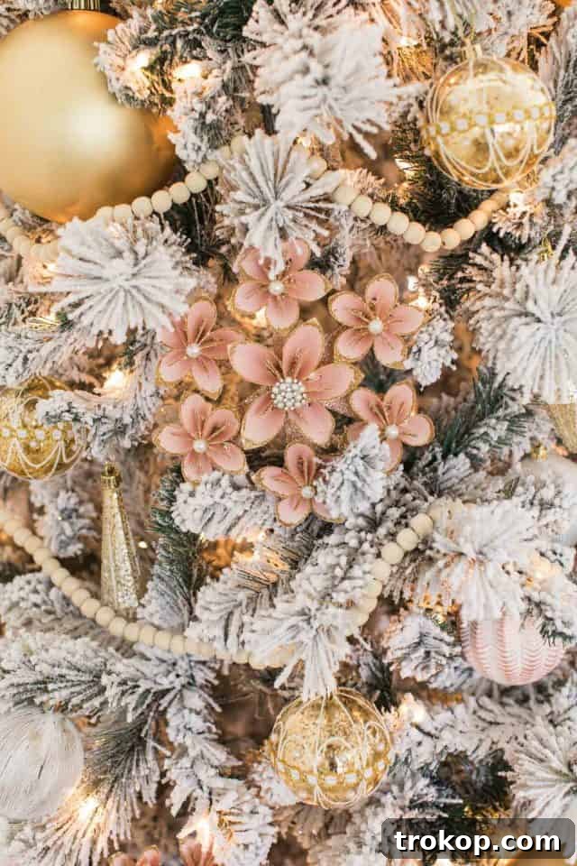 A Pink and Gold Christmas Dream in Our Living Room 11 paper pink ornaments on the christmas tree