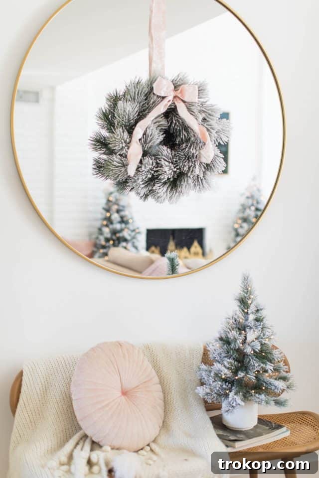 A Pink and Gold Christmas Dream in Our Living Room 15 christmas wreath on a mirror with bench