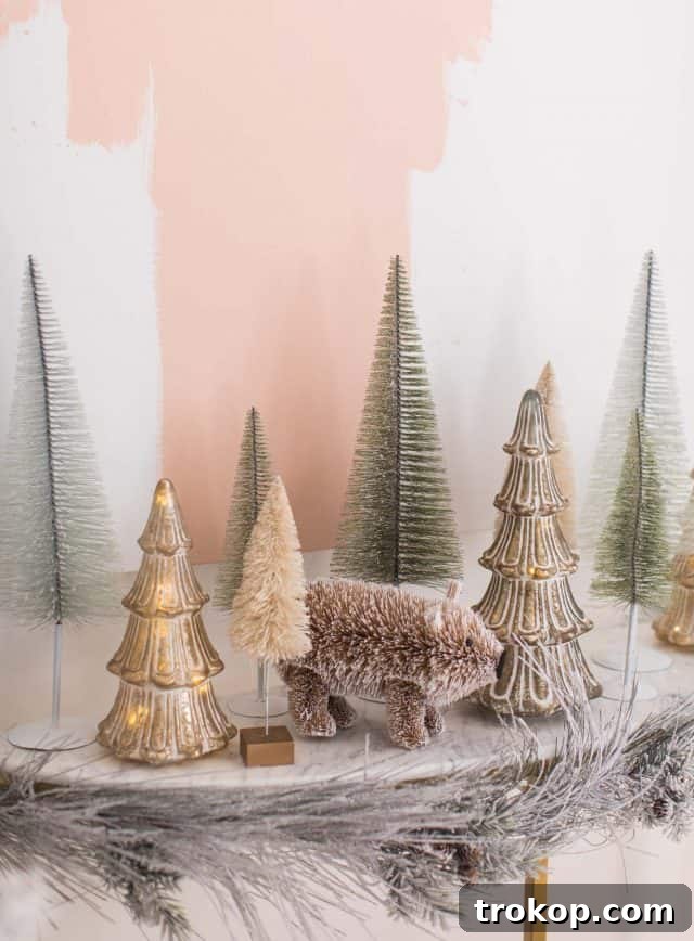 A Pink and Gold Christmas Dream in Our Living Room 9 photo of bottle brush trees on a console table
