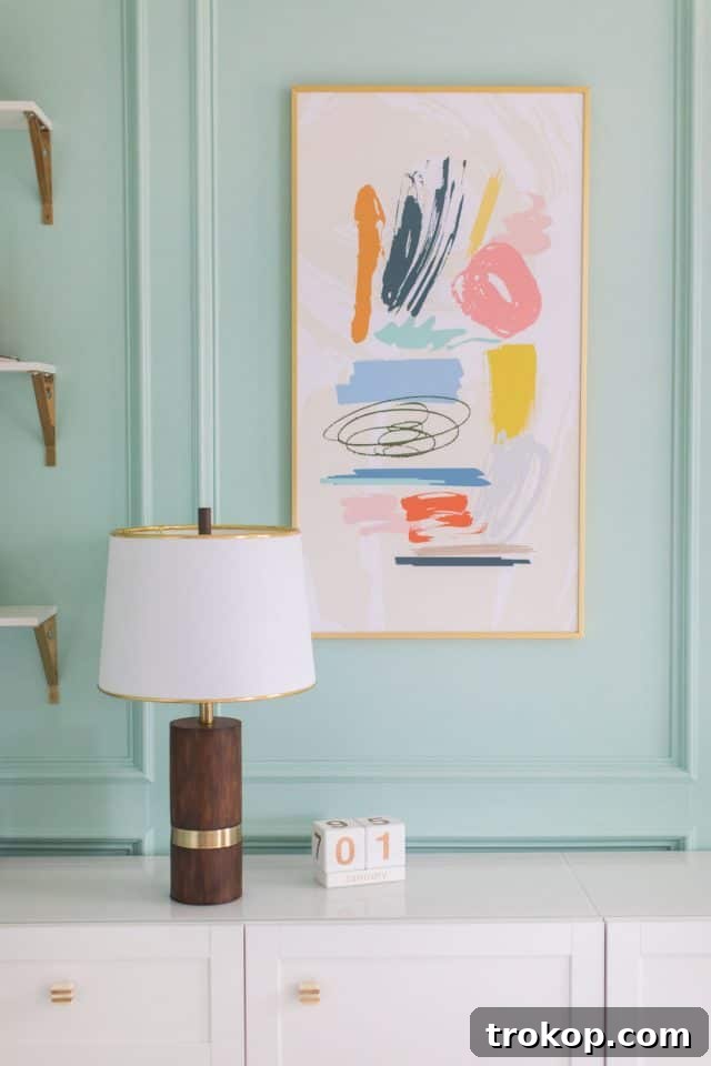 Unveiling Our Dream Home Office Design 12 A tastefully decorated corner of a home office featuring custom artwork and a stylish lamp.