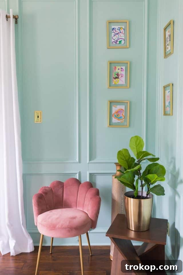 Unveiling Our Dream Home Office Design 14 Cozy seating area in a home office design, featuring a pink scalloped chair and framed artwork.