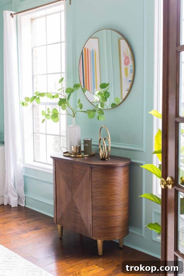 Unveiling Our Dream Home Office Design 18 A wooden credenza with glass windows, stylishly integrated into a home office design.