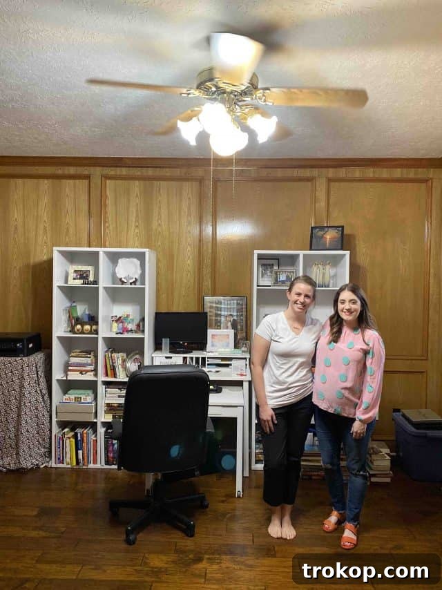 Unveiling Our Dream Home Office Design 4 Before photo of a home office, featuring dark paneling and a cluttered appearance, awaiting a modern makeover.
