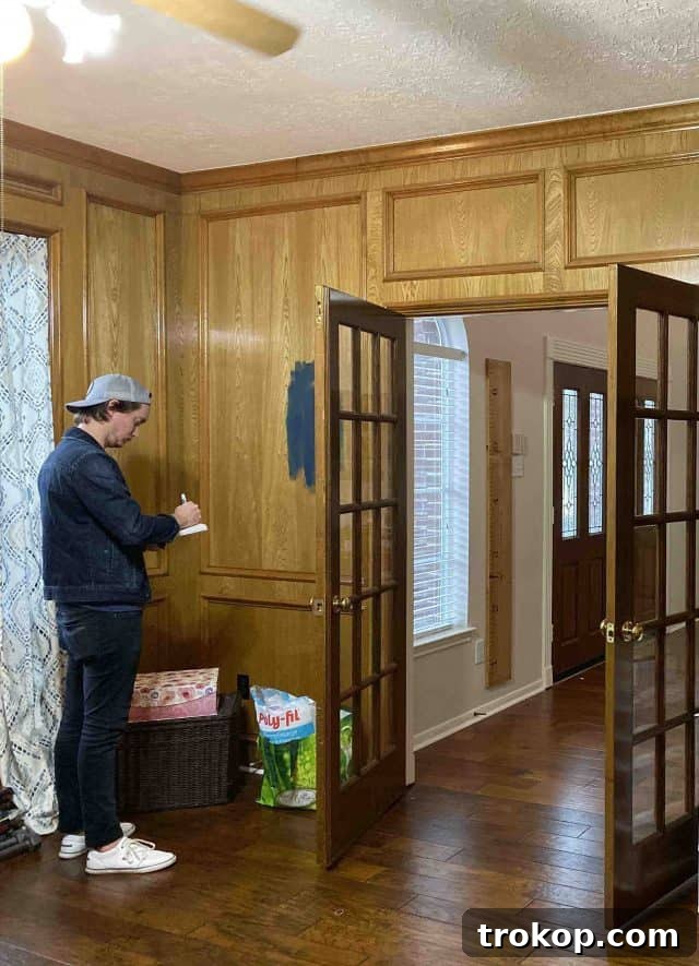 Unveiling Our Dream Home Office Design 6 A 'before' shot capturing the initial measurements and assessment of a home office space before the makeover began.