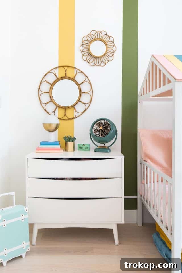 Vibrant Little Girls Room Makeover 22 Close-up of the table area with chalkboard, bookshelves, and pendant light.