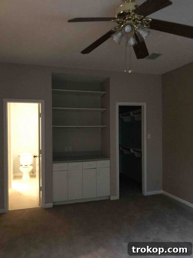 Vibrant Little Girls Room Makeover 6 Another before shot of the room, showing dated built-ins and poor lighting.