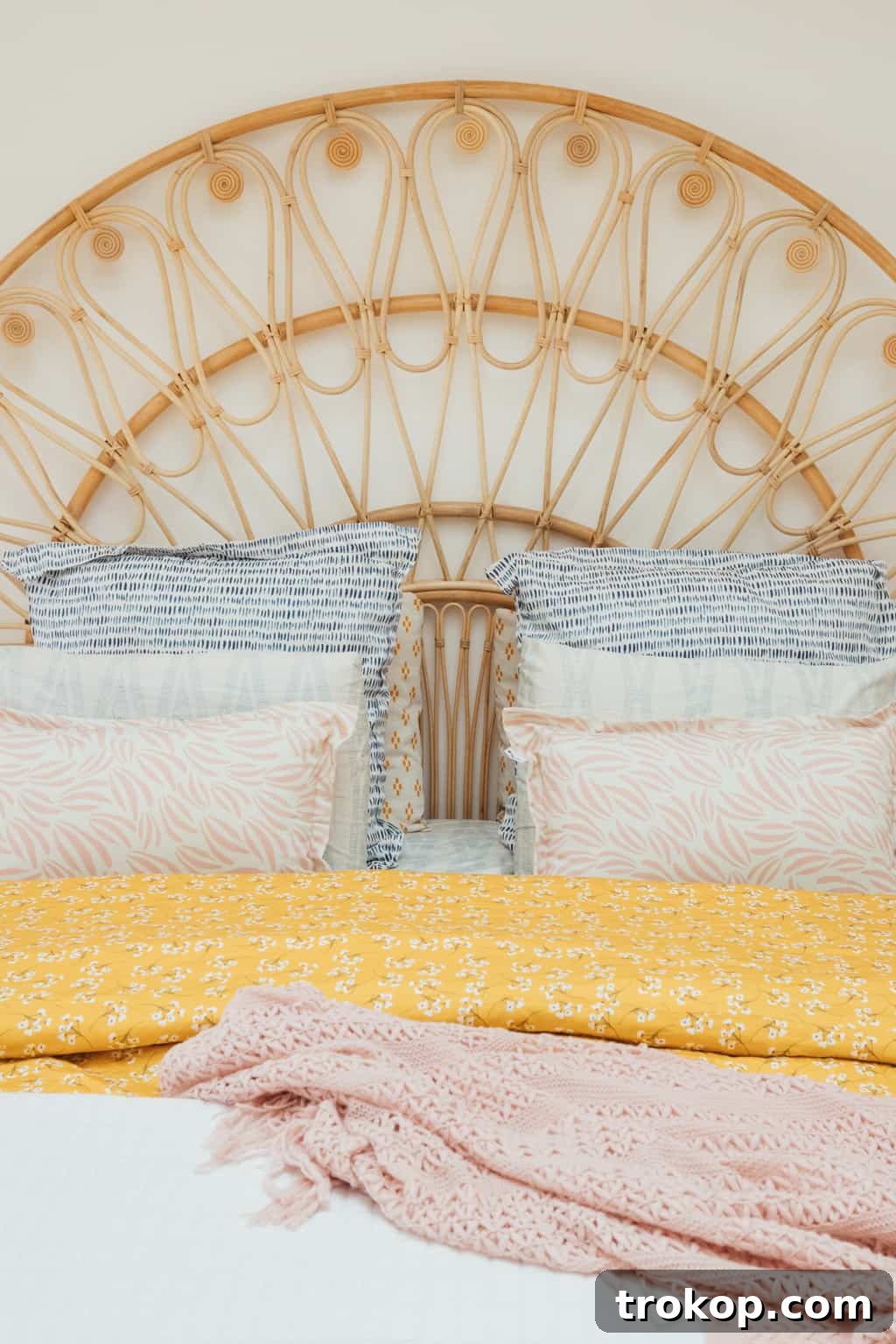 Lakeside Master Bedroom A Stunning Transformation 16 Custom patterned bedding and rattan bed in the transformed master bedroom