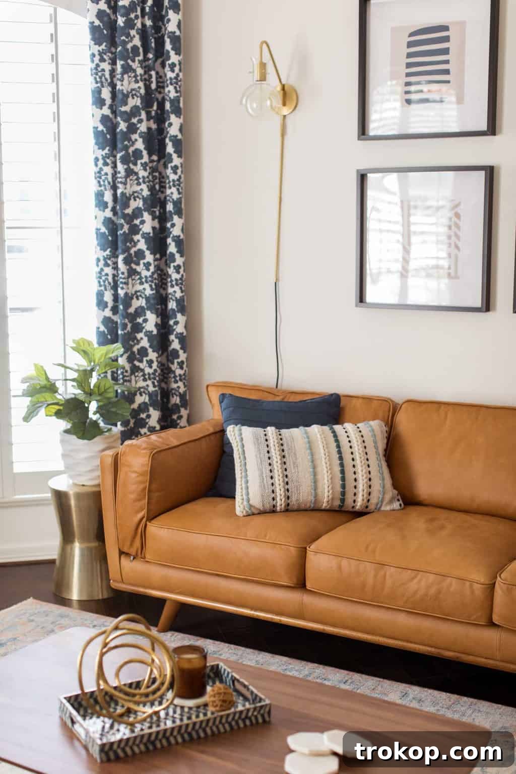 A Transitional Living Room's Stunning Style Transformation 11 Photo of the sleek, modern mid-century style sofa from Article, a key piece in the living room makeover, offering both comfort and style.
