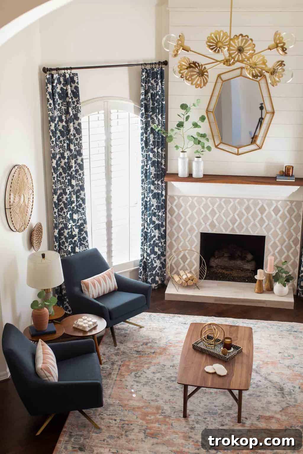 A Transitional Living Room's Stunning Style Transformation 15 Close-up photo of a modern geometric mirror, strategically placed to add height and contemporary style to the living room.