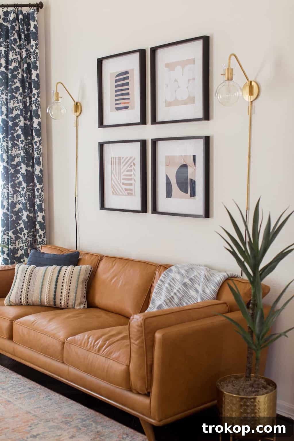A Transitional Living Room's Stunning Style Transformation 2 Close-up photo of modern artwork and accent decor in the newly redesigned transitional living room, showcasing texture and color.