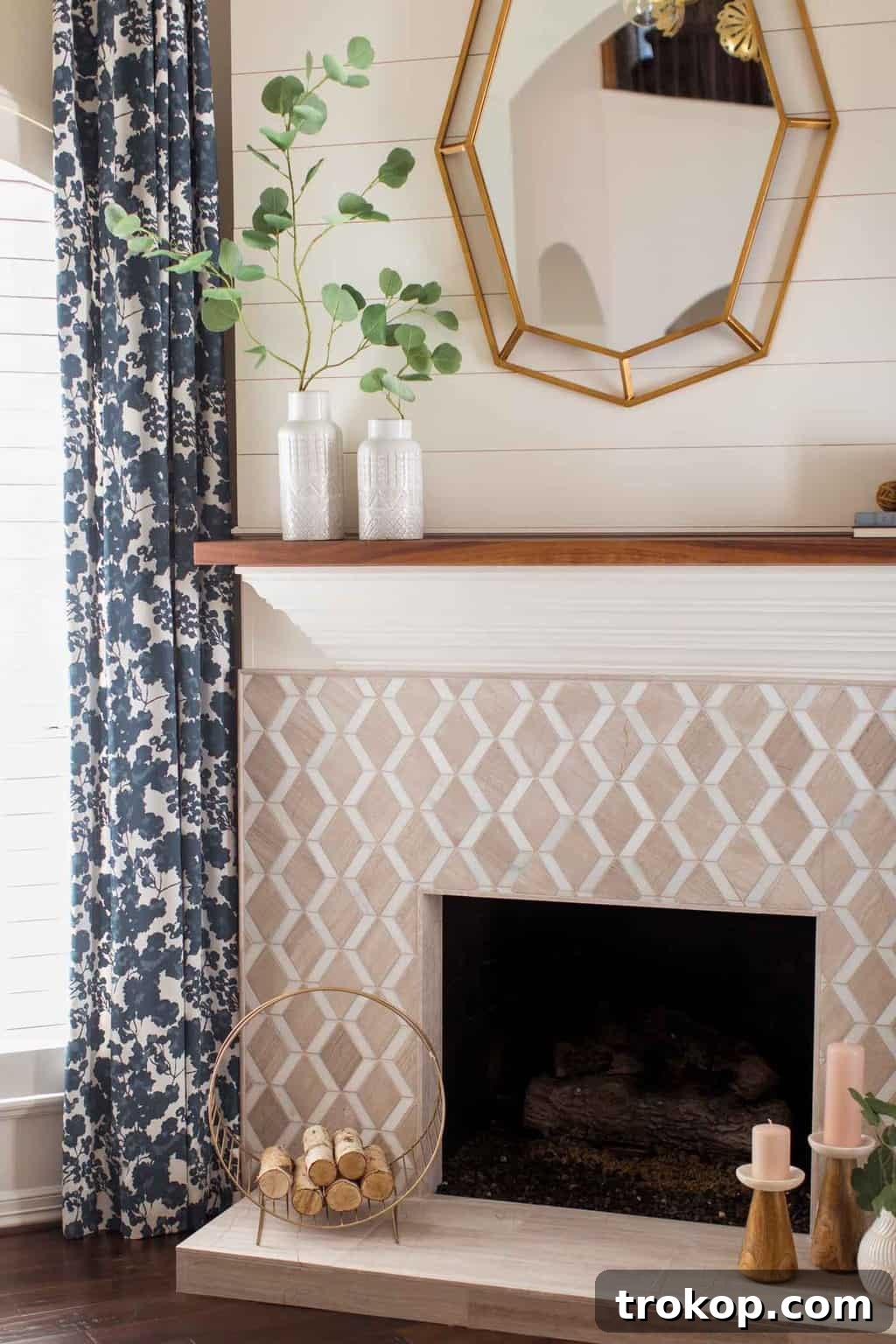A Transitional Living Room's Stunning Style Transformation 6 Detailed after photo of the modernized living room fireplace and mantle, featuring geometric tiles and clean lines.