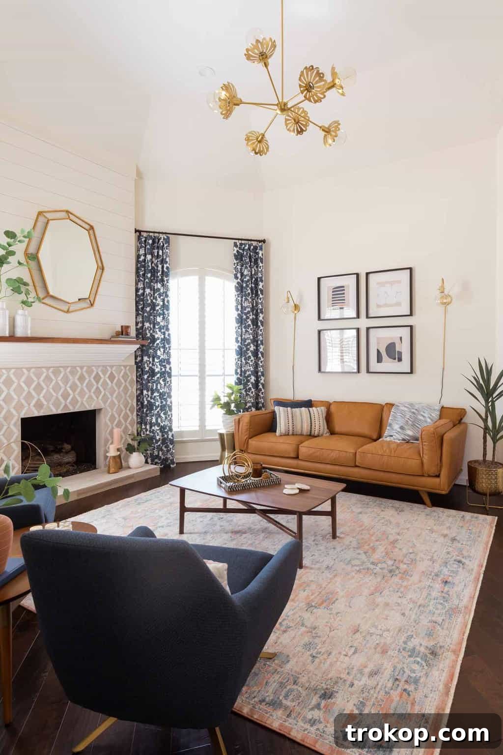 A Transitional Living Room's Stunning Style Transformation 8 Stunning photo of the new chandelier that replaced an old fan in the living room, adding a touch of modern elegance and brightness.