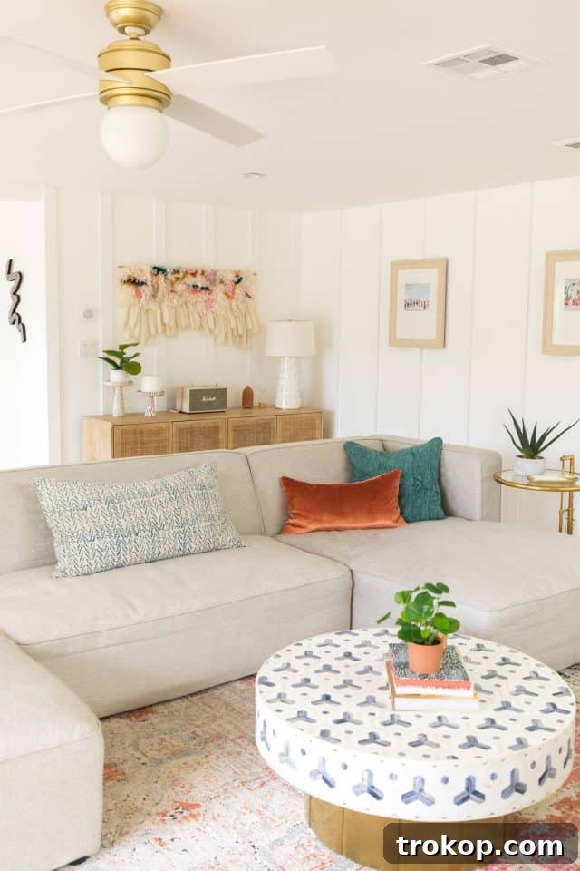 Living room showcasing new furniture, rug, and coffee table