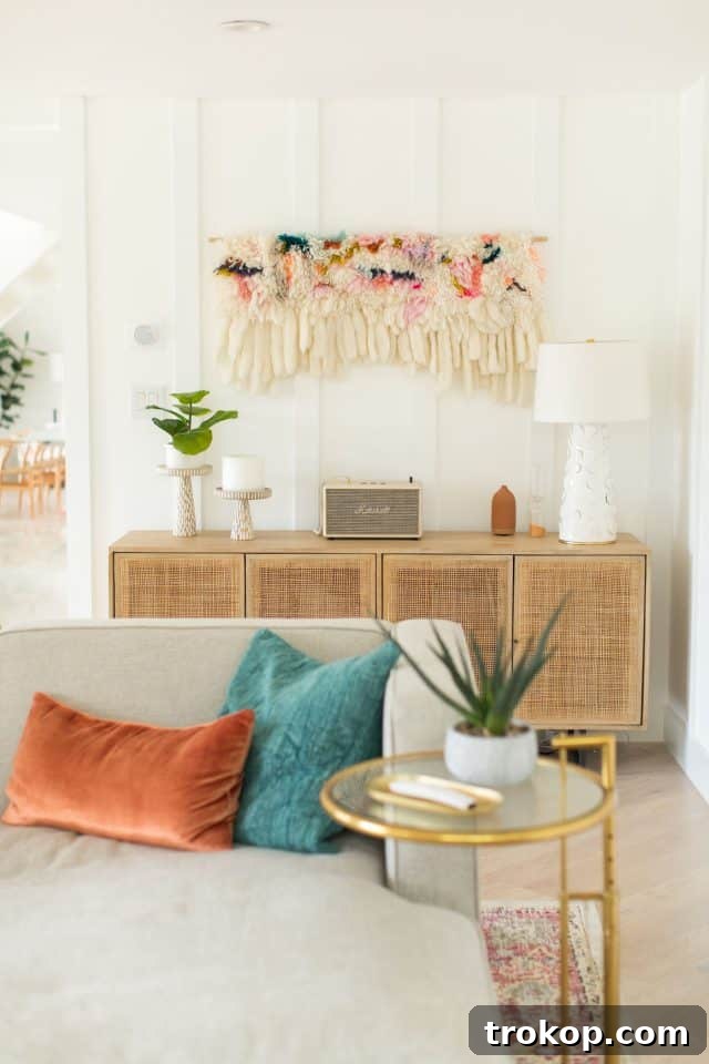 Detail of modern living room with large windows and white walls