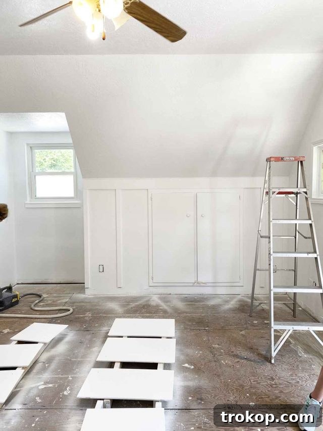 freshly painted white board and batten accent wall in a renovated garage apartment