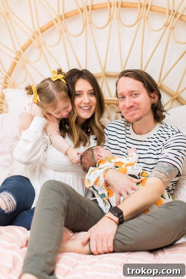 Luca's Newborn Journey: Our Favorite Captures 11 Joyful family photo of Ashley Rose, her husband, toddler Gwen, and newborn Luca