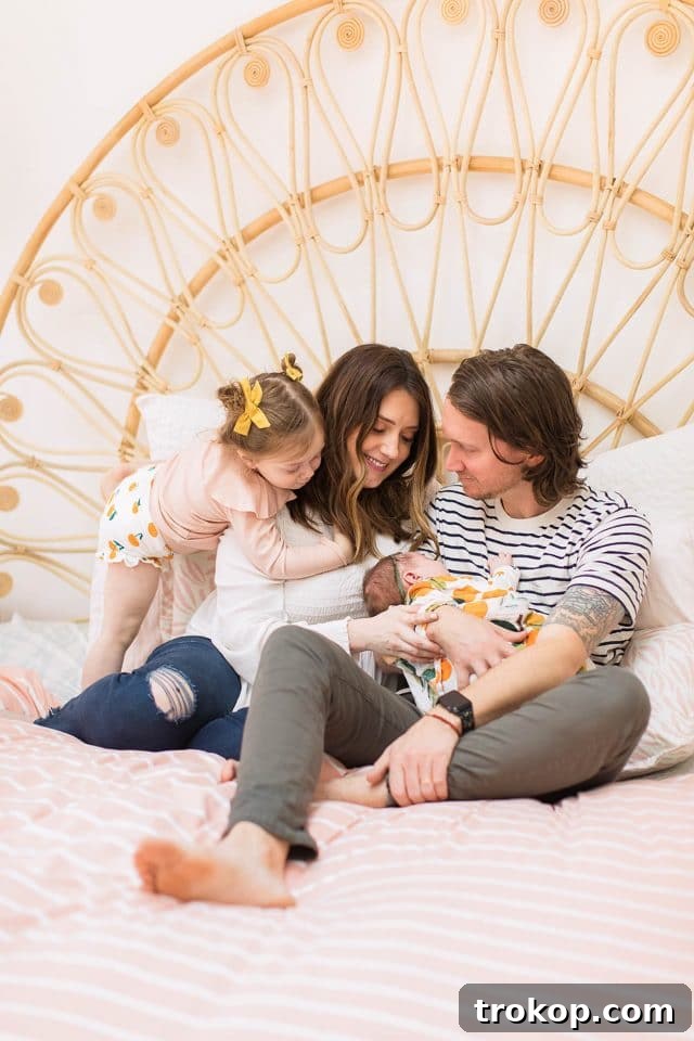 Luca's Newborn Journey: Our Favorite Captures 12 Sweet family photo with newborn Luca, capturing a tender moment