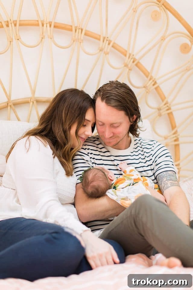 Luca's Newborn Journey: Our Favorite Captures 13 Loving photo of mom and dad with their newborn baby Luca