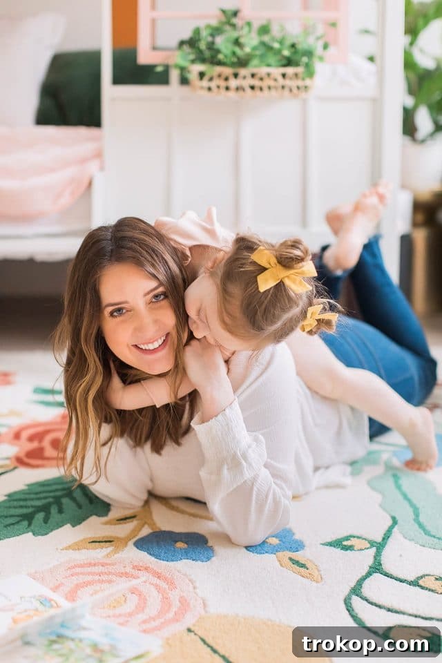 Luca's Newborn Journey: Our Favorite Captures 16 Mom and daughter Gwen enjoying time together in her vibrant toddler room