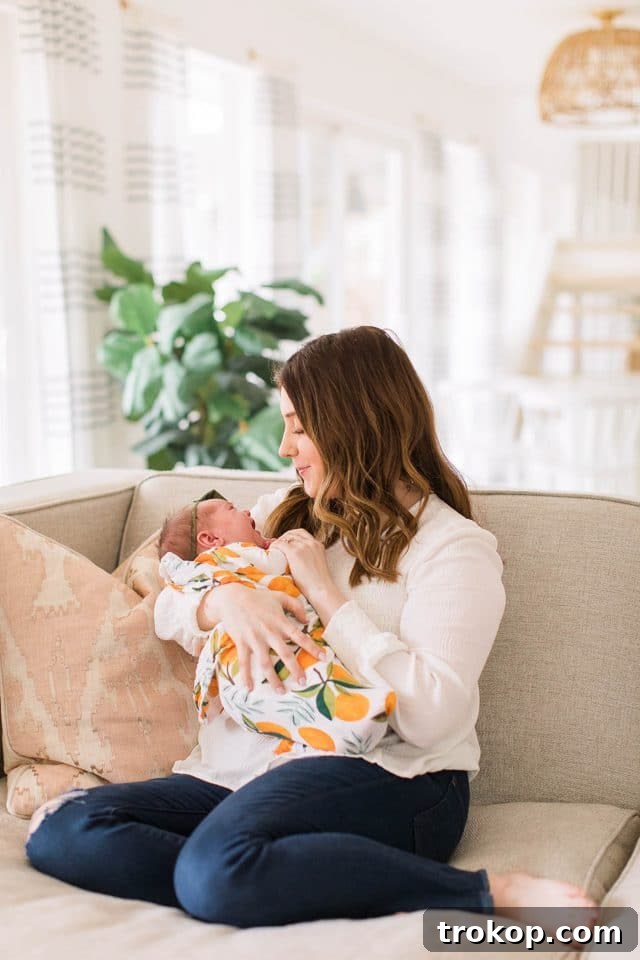 Luca's Newborn Journey: Our Favorite Captures 20 Loving mom holding her newborn daughter Luca tenderly