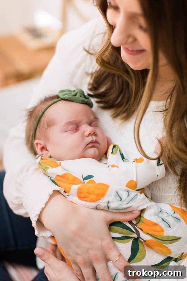 Luca's Newborn Journey: Our Favorite Captures 10 Newborn baby girl Luca being gently held in her mother's arms