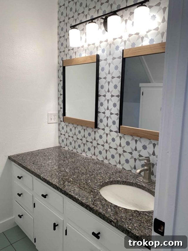 Weekly Highlights: Garage Makeover and Home Finds 5 Finished bathroom wall with newly installed peel and stick tiles, awaiting new faucet and styling.