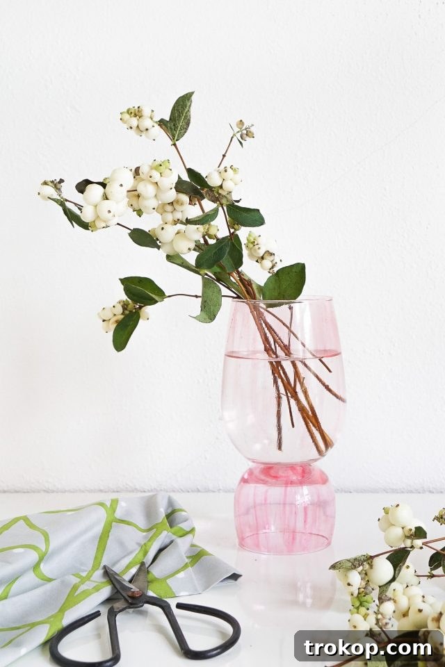 Creative DIY Color-Glazed Stacked Vases, made from mismatched glasses, for unique floral displays.