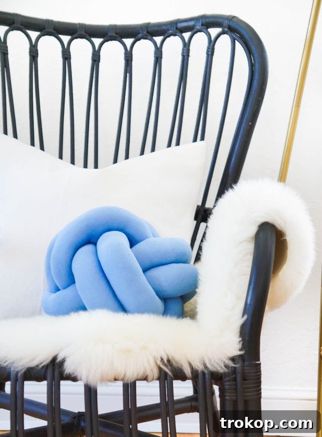 A trendy and cozy DIY Knot Pillow, a popular reader favorite for stylish home decor.