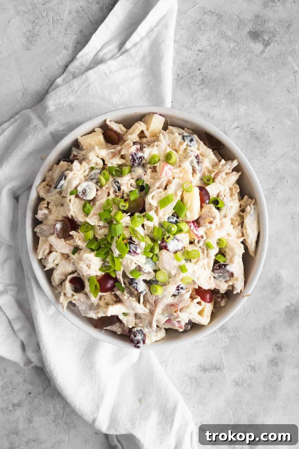 The Definitive Chicken Salad 4 The perfectly prepared chicken salad, garnished and ready for serving on a platter.