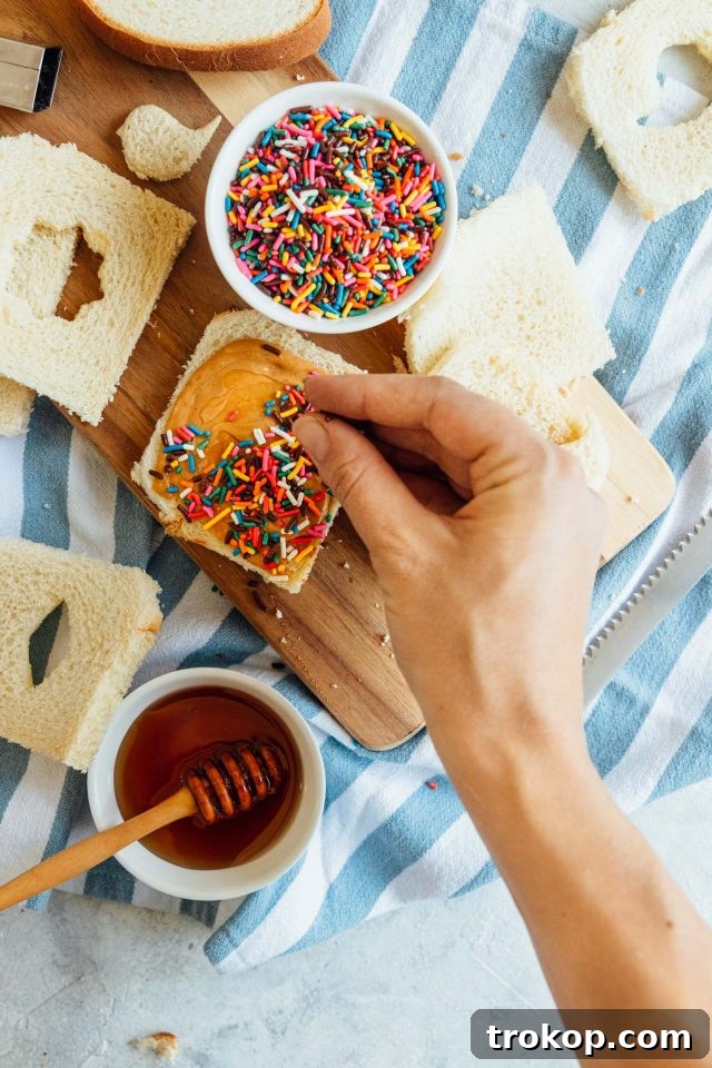 Fairy Bread Creation Another appealing image of the fairy bread recipe, emphasizing its vibrant appeal and deliciousness, from Ashley Rose of Sugar & Cloth.