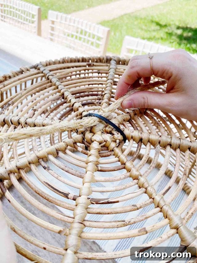 Light Up Your Patio: Cordless DIY Kit 5 Securing the LED light with zip ties inside the basket.
