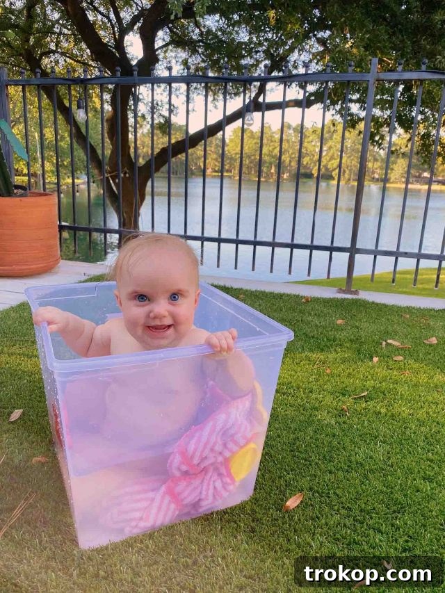 The Weekly Home Edit 2 A heartwarming scene of Luca enjoying a refreshing bath outdoors on the deck, surrounded by sunshine and fresh air.