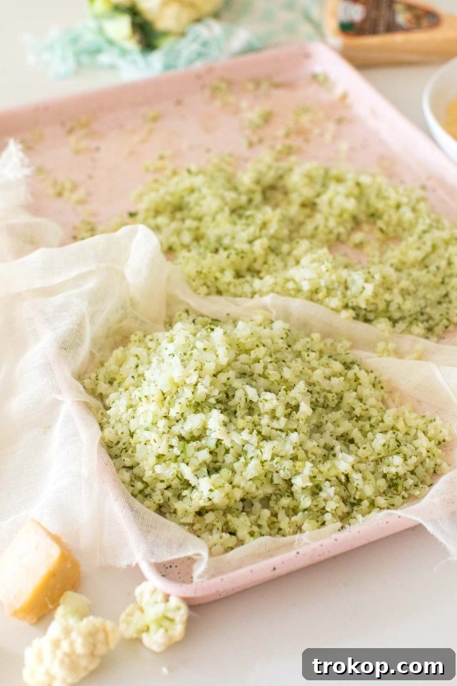 Guilt-Free Cauliflower Pizza Crust for Your Low-Carb Lifestyle 6 Seasoned cauliflower florets drying on a cheesecloth, essential for a firm crust