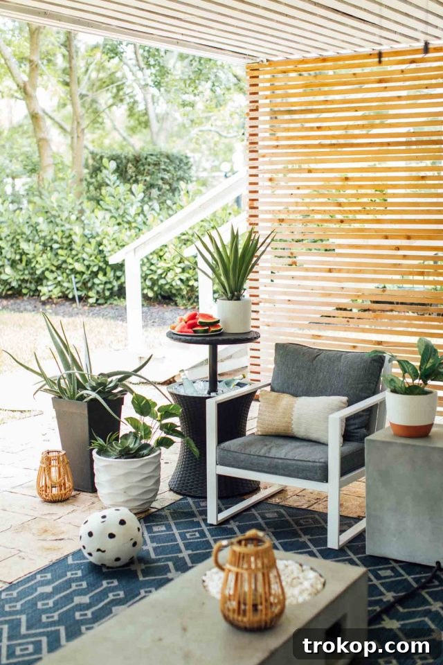 Stylish backyard cooler setup next to a modern outdoor seating area, perfect for weekend gatherings.