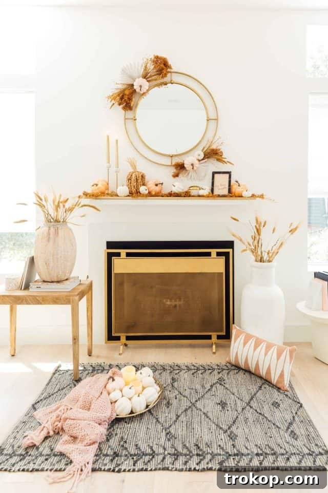 a fireplace with fall pumpkins and styling 