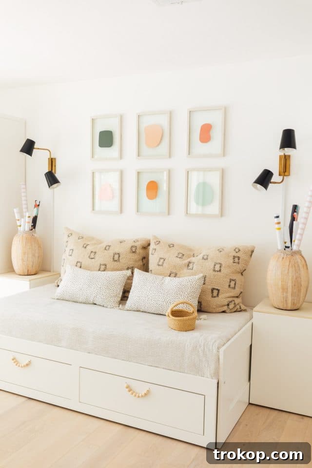Playroom Makeover: DIY Faux Built-In Cabinets for Organized Fun 11 Ikea Brimnes daybed hack in a kids room with custom artwork