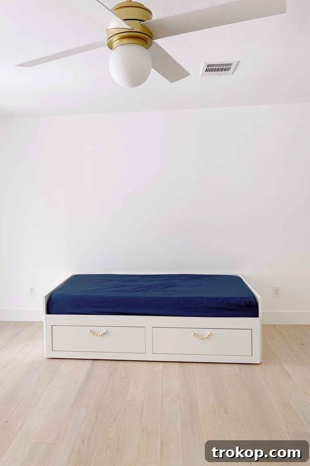 Playroom Makeover: DIY Faux Built-In Cabinets for Organized Fun 6 Ikea Brimnes daybed integrated into playroom design for cozy seating and storage