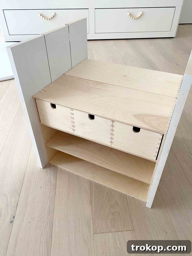 Upcycled Ikea Play Table Project 10 Step 3 in making a DIY Kids Table: Attaching the tabletop with L brackets