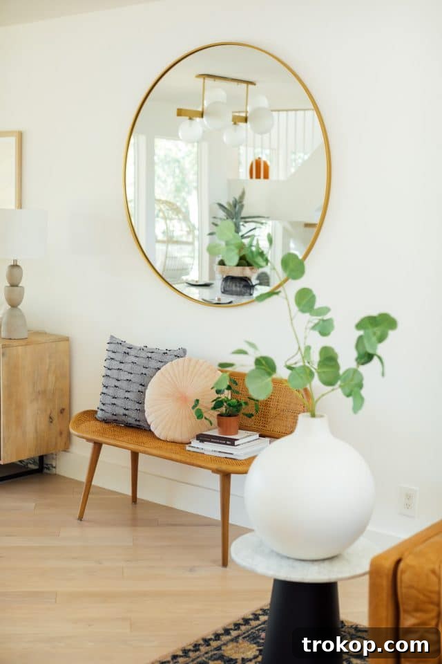 Revitalized Open-Plan Living and Dining Space 15 Living room decor featuring textured pillows and plants, creating a warm and inviting atmosphere.